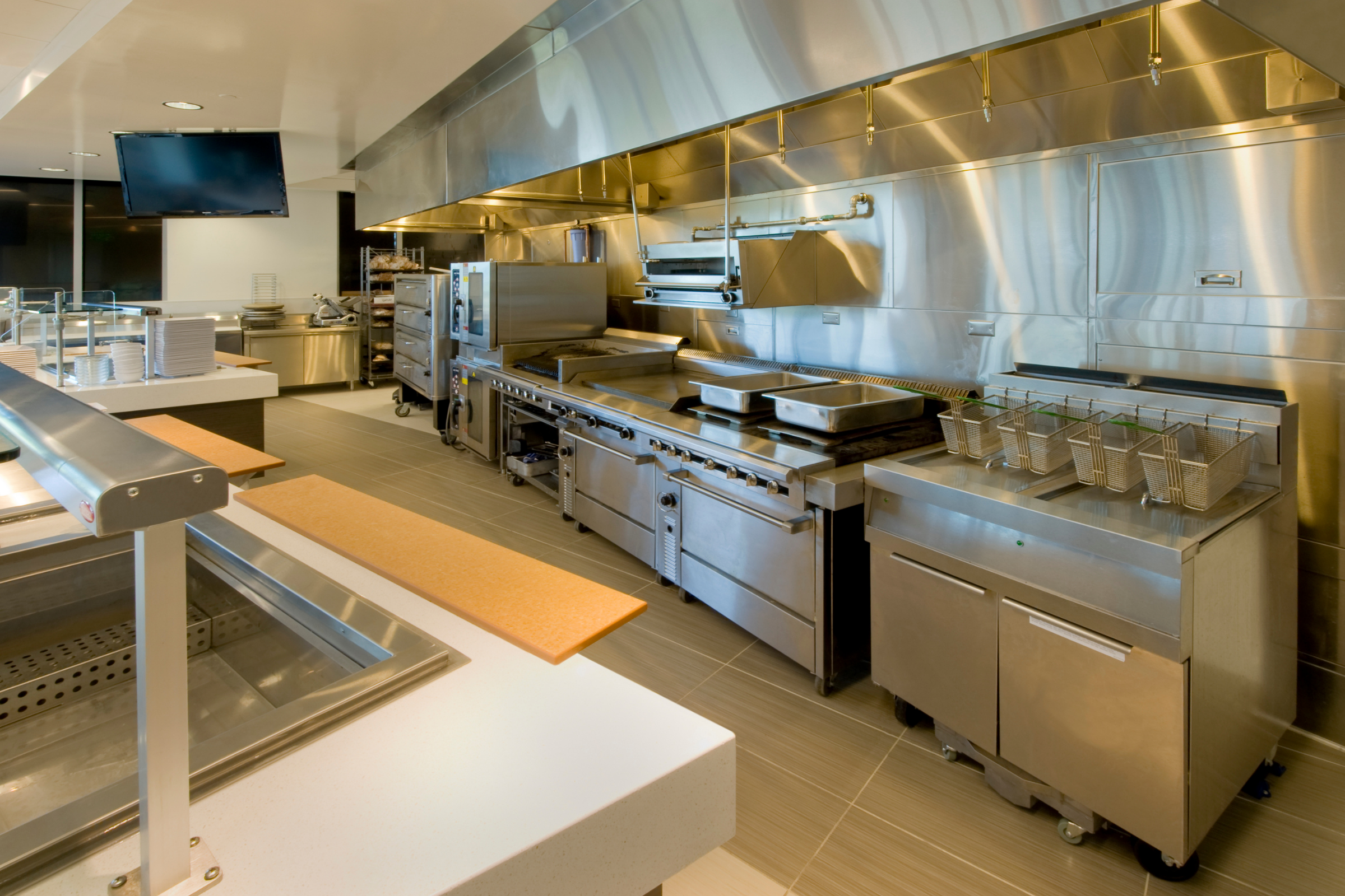 a very clean and shiny commercial kitchen